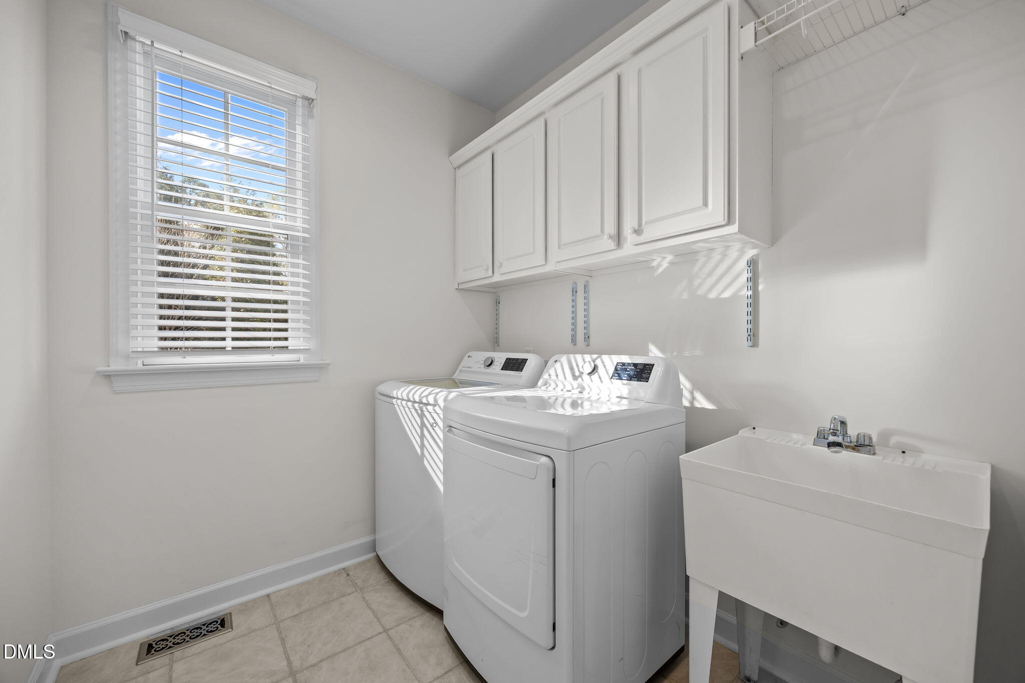13 Morgans Ridge Lane Durham, NC 27707 - Photo 45 of 53 a utility room with a sink washer and dryer