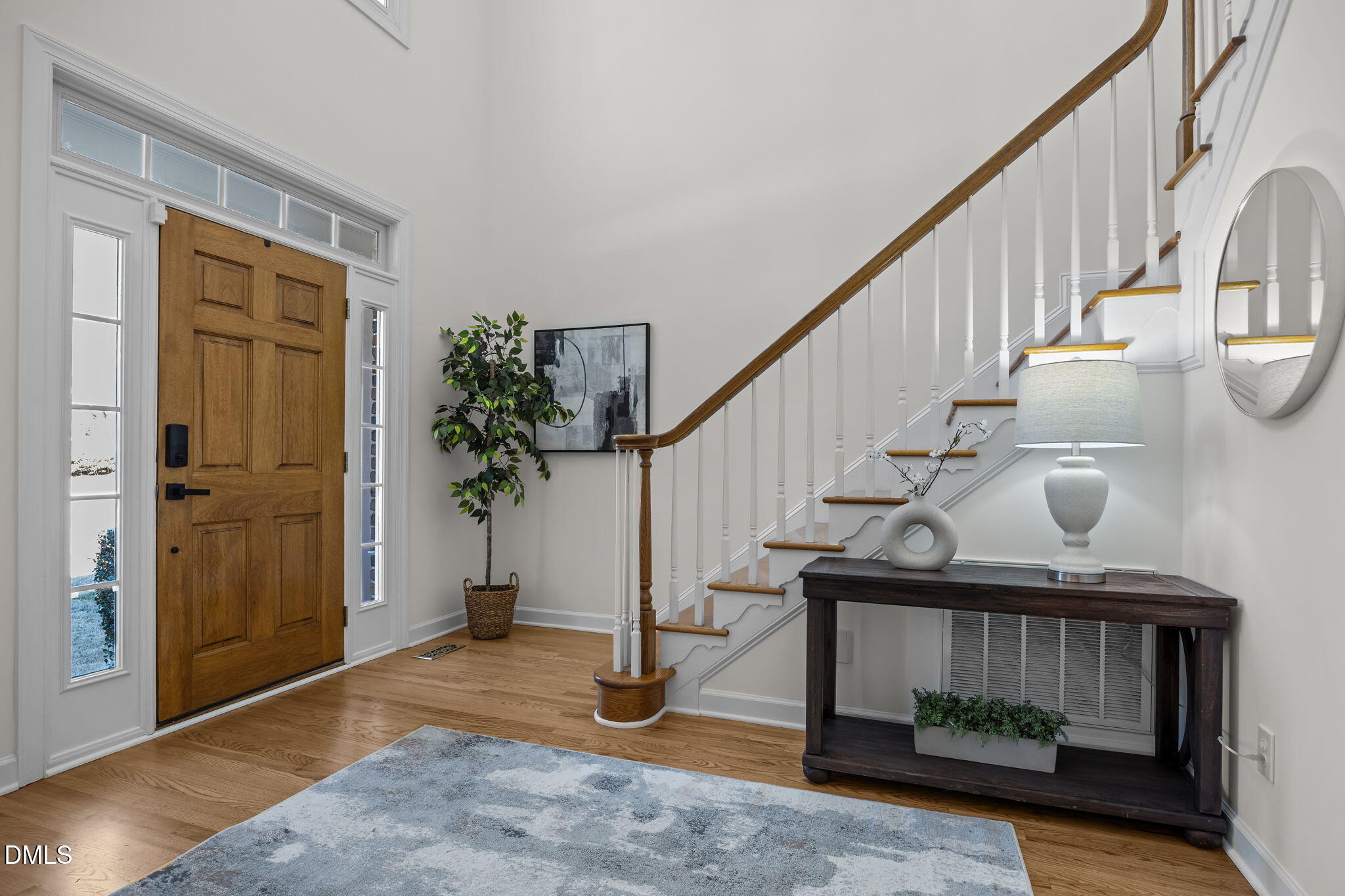 13 Morgans Ridge Lane Durham, NC 27707 - Photo 8 of 53 a view of entryway with wooden floor and stairs
