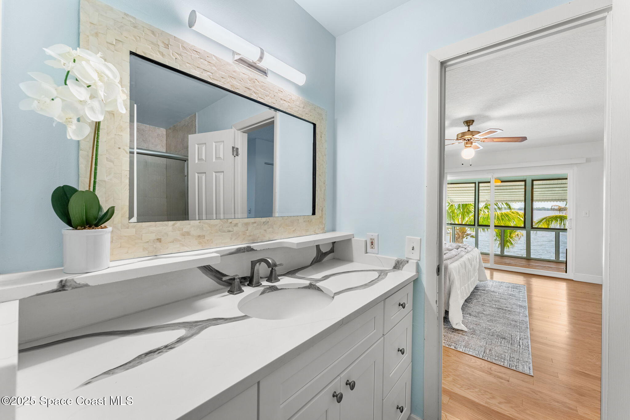 2016 Indian River Drive Cocoa, FL 32922 - Photo 22 of 49 a bathroom with a double vanity sink and mirror