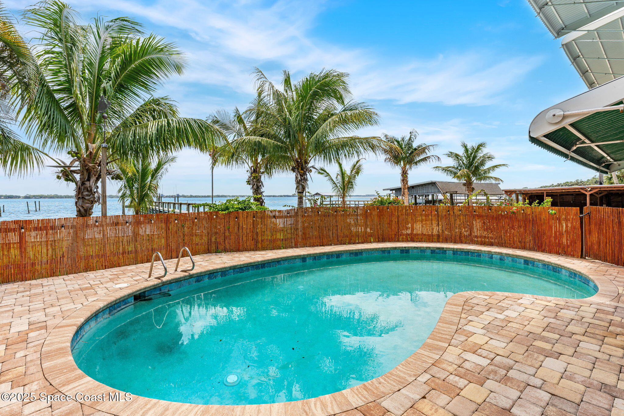 2016 Indian River Drive Cocoa, FL 32922 - Photo 6 of 49 a view of a backyard with swimming pool