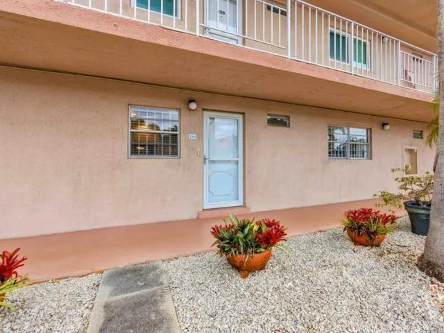a view of a house with yard and garden