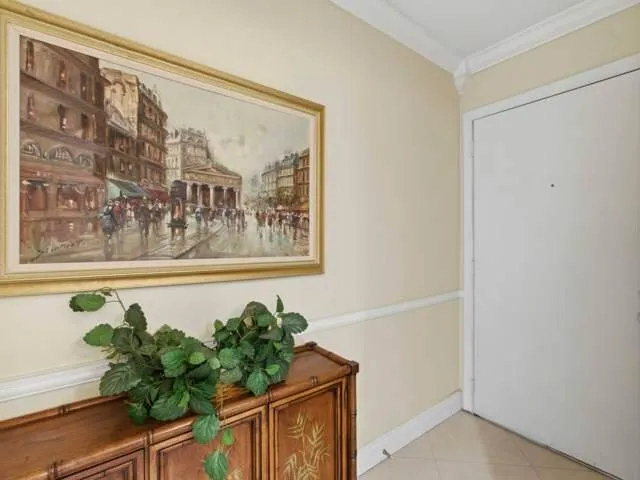 a vase of flowers sitting on a shelf