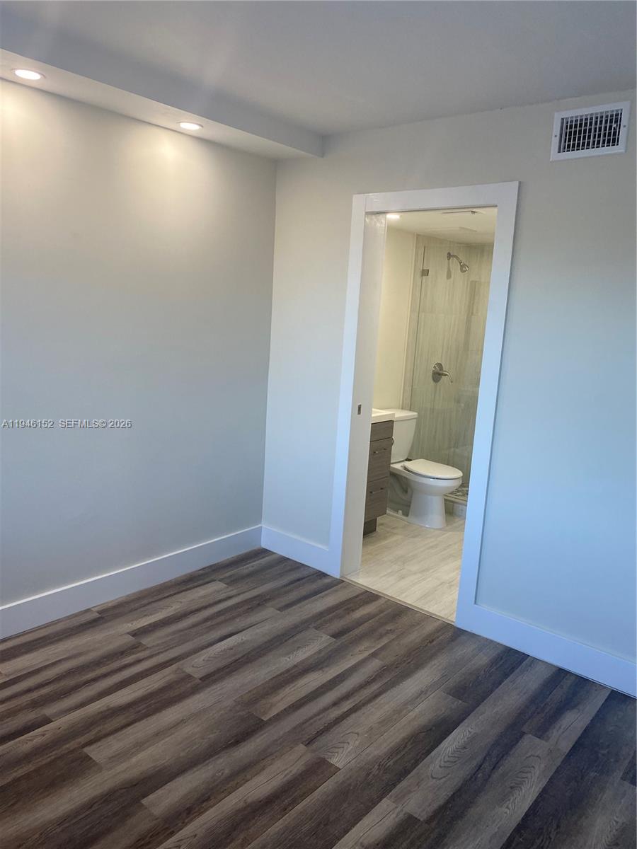 2575 Southwest 27th Avenue, Unit 212 Coconut Grove, FL 33133 - Photo 11 of 12 a bathroom with a sink and a toilet