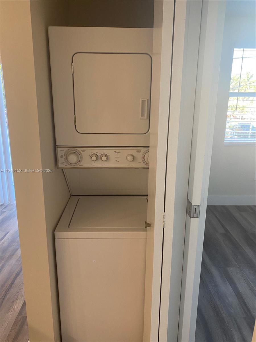 2575 Southwest 27th Avenue, Unit 212 Coconut Grove, FL 33133 - Photo 6 of 12 a utility room with dryer and washer