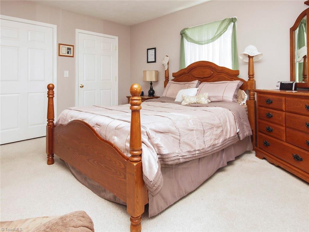 571 Ridge Road Mocksville, NC 27028 - Photo 15 of 30 Master Bedroom showing his and her closets