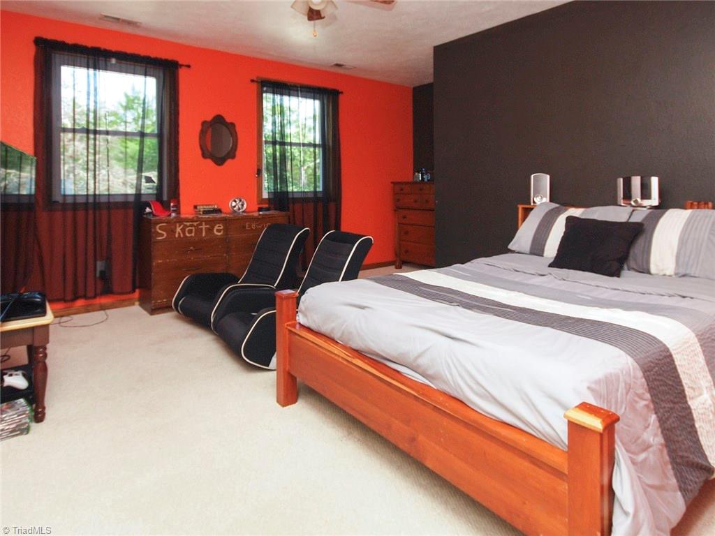 571 Ridge Road Mocksville, NC 27028 - Photo 19 of 30 Large bedroom -first on the right as you go down the hall upstairs