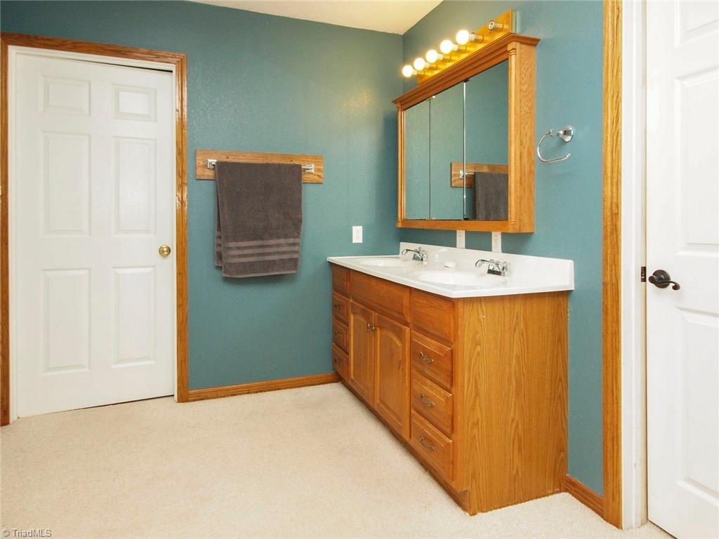 571 Ridge Road Mocksville, NC 27028 - Photo 20 of 30 Bathroom Vanity for upstairs bedrooms. The toilet and bath/shower are behind the door straight ahead.