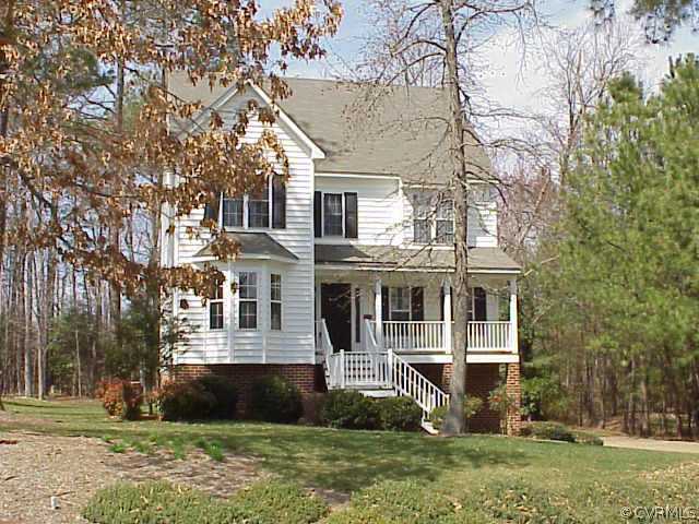 12008 Taplow Road Midlothian, VA 23112 - Photo 1 of 2 front view of a house with a yard