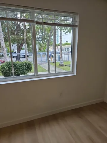 a view of room with a large window