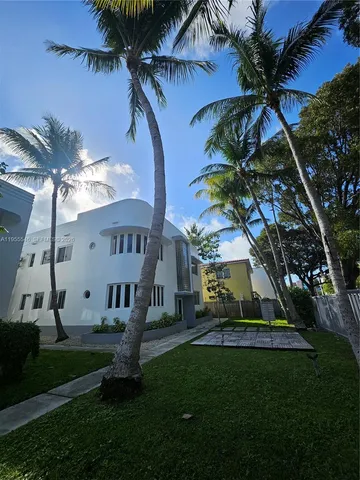 a view of house with yard and entertaining space
