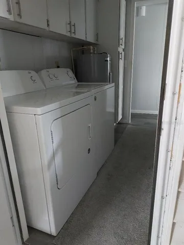 a bedroom with bed and window