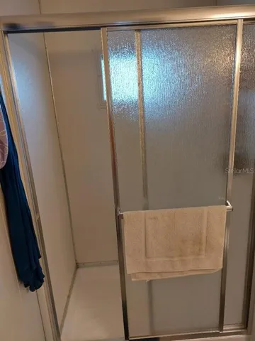 a bathroom with a sink toilet and mirror