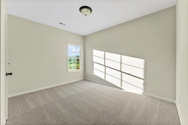 a view of a room with windows