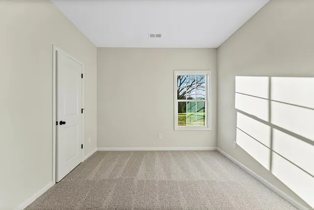 a view of room with window and hardwood floor