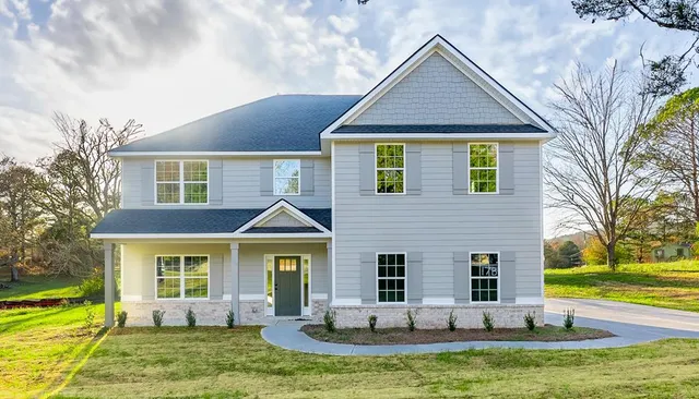 a view of a house with a yard