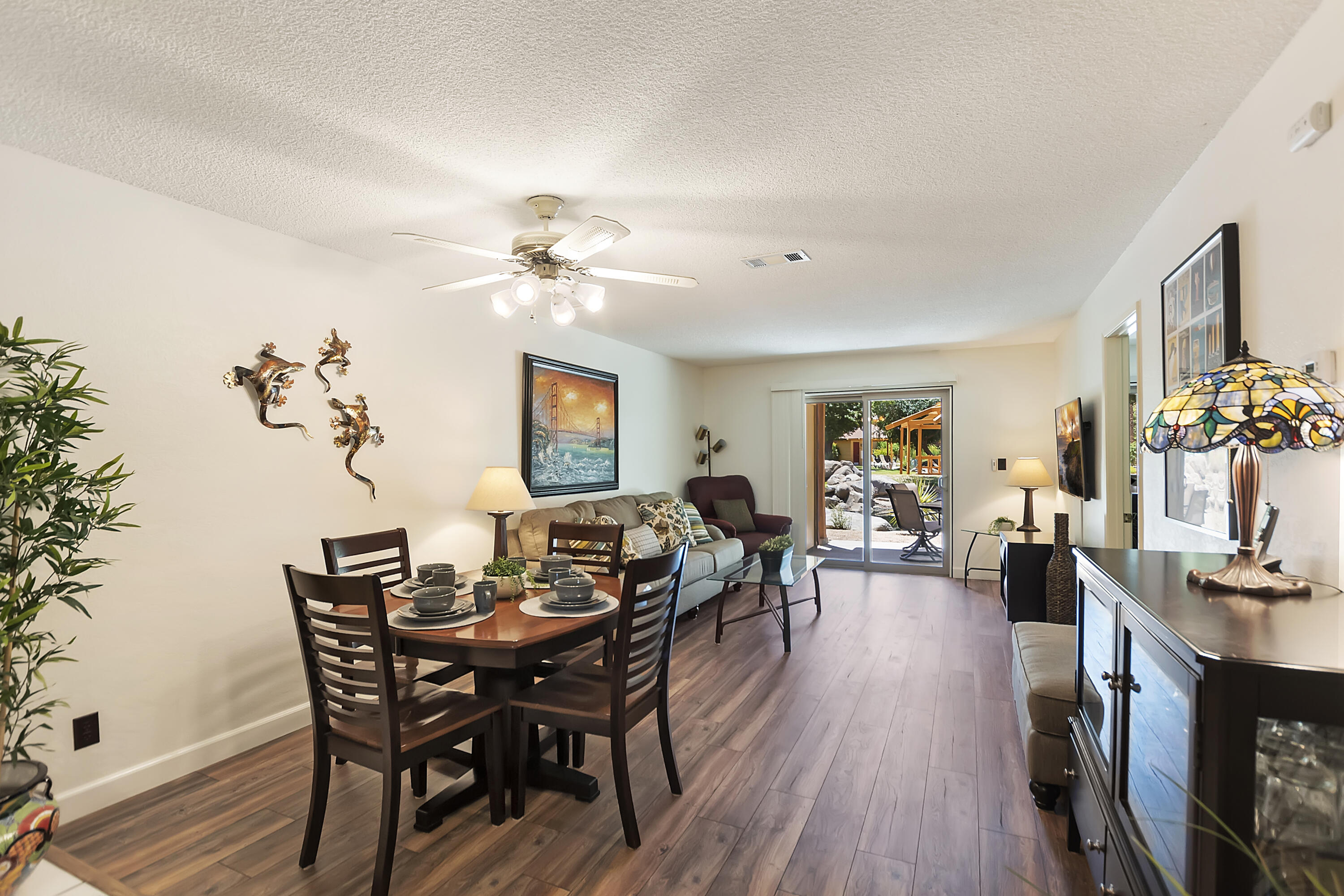 a view of a dining room with furniture and wooden floor