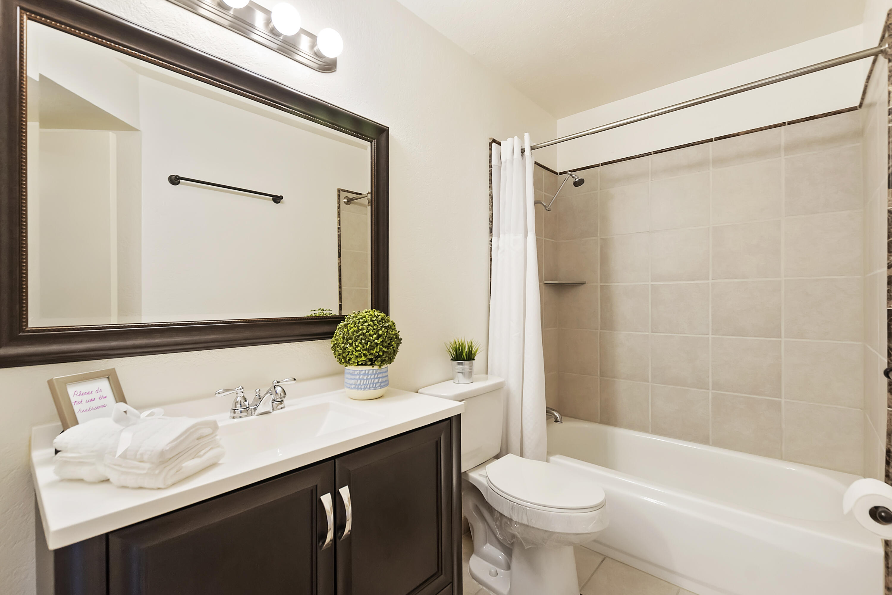 48255 Monroe Street, Unit 6 Indio, CA 92201 - Photo 15 of 43 a bathroom with a sink and a mirror