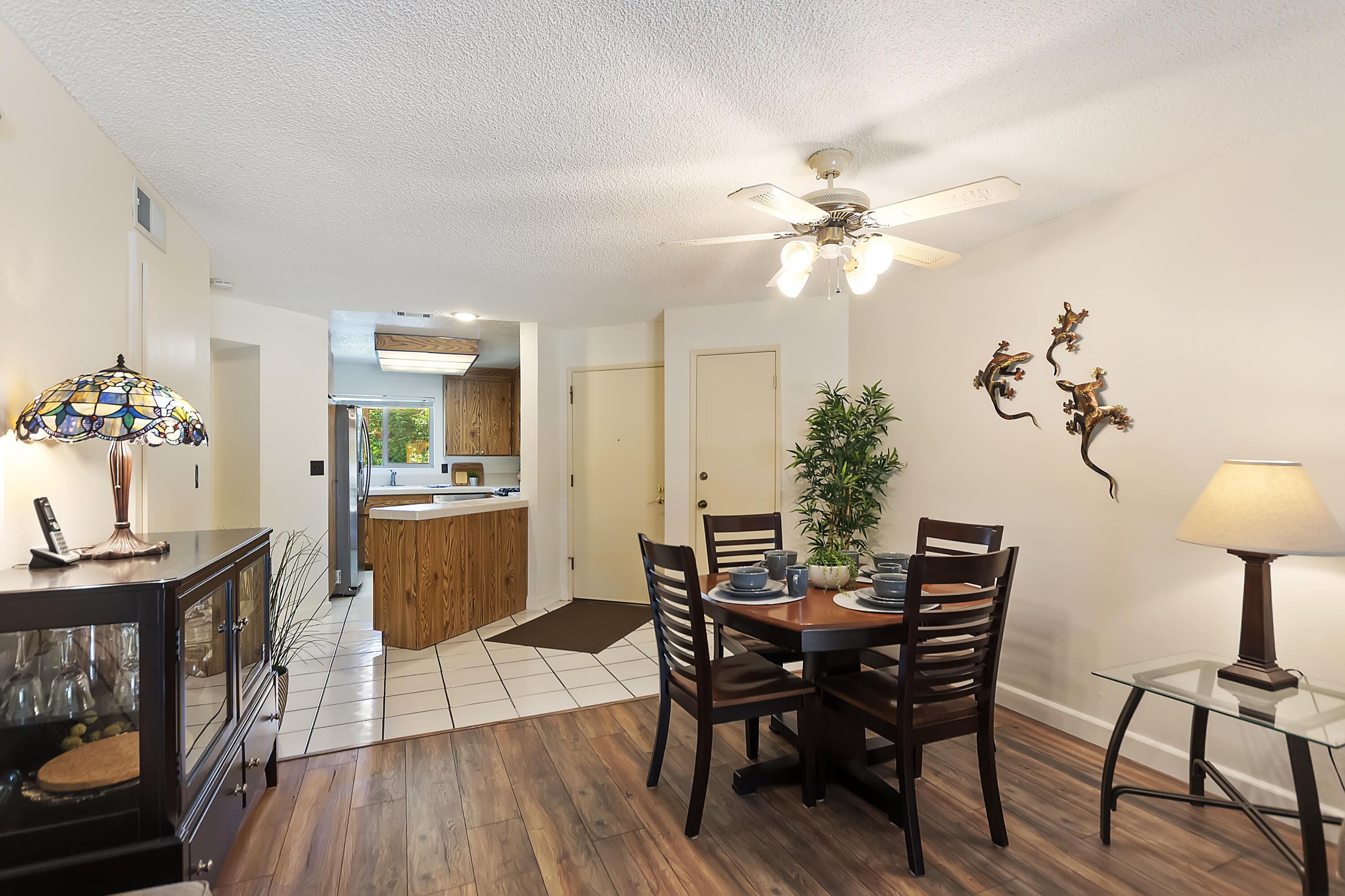 48255 Monroe Street, Unit 6 Indio, CA 92201 - Photo 2 of 43 a view of a dining room with furniture and wooden floor