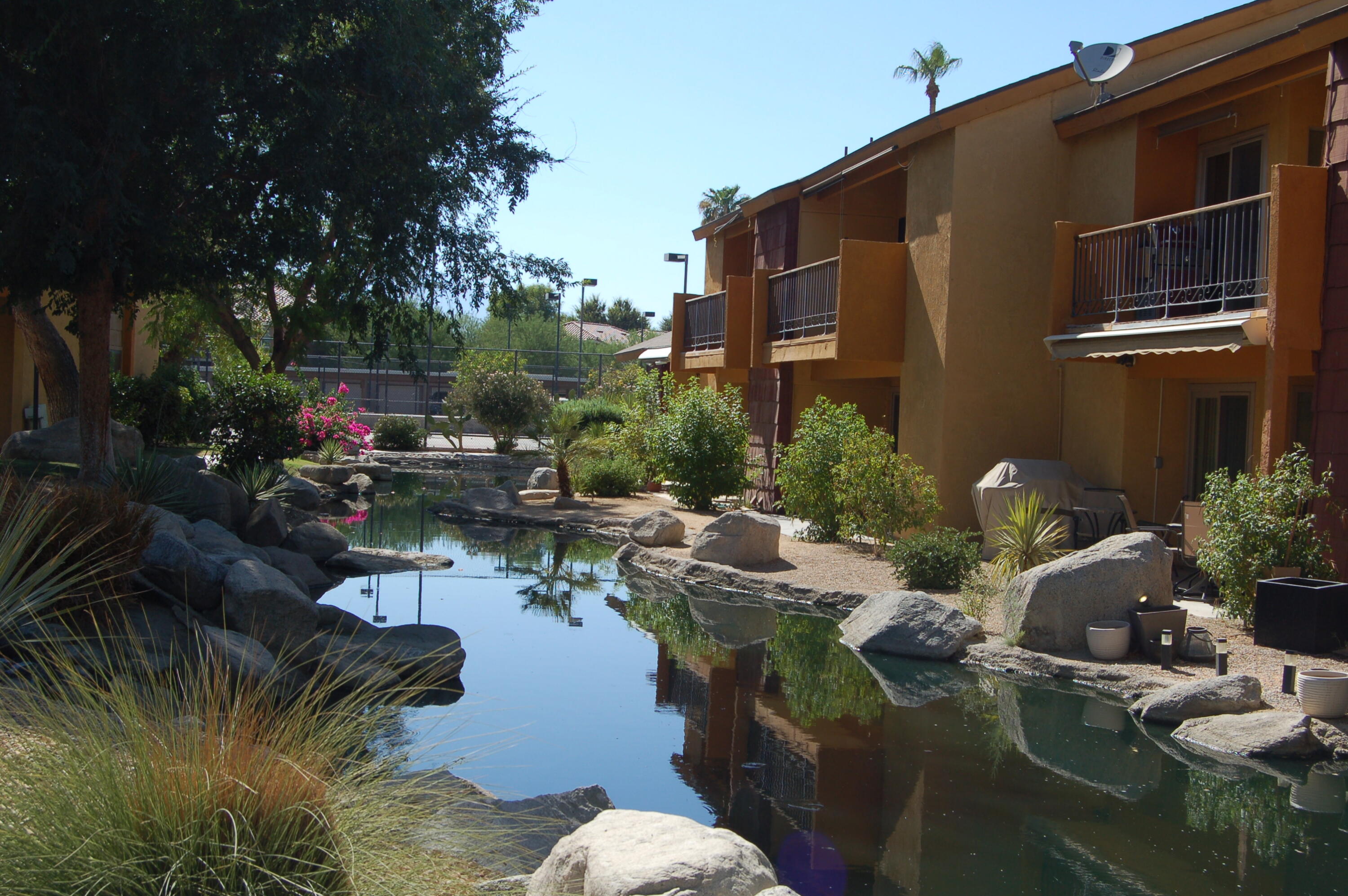 48255 Monroe Street, Unit 6 Indio, CA 92201 - Photo 28 of 43 a backyard of a house with outdoor seating