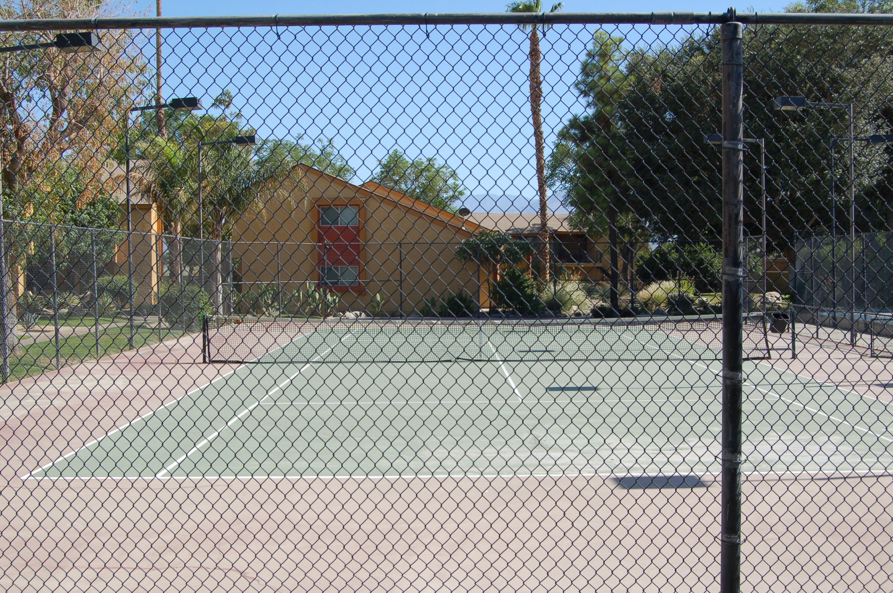 48255 Monroe Street, Unit 6 Indio, CA 92201 - Photo 30 of 43 a small yard with a white wall