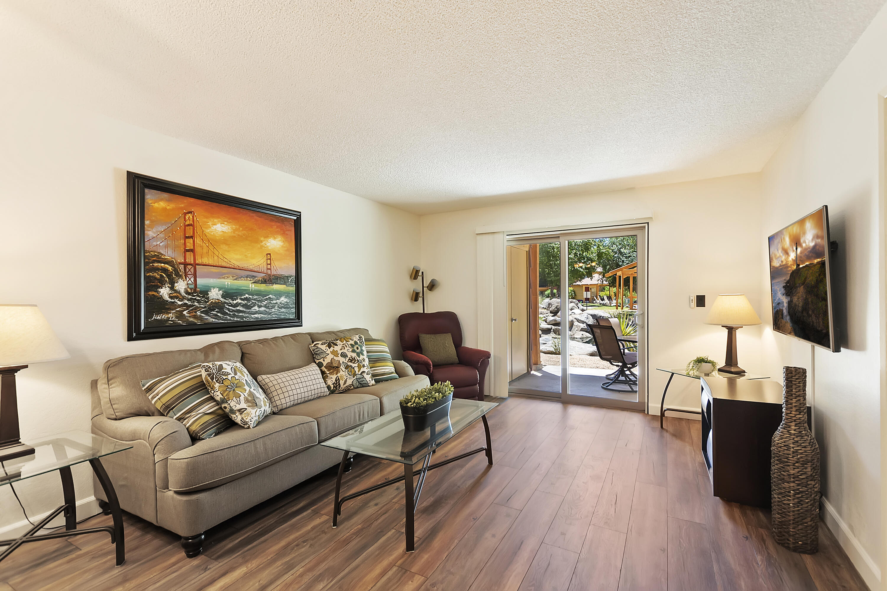 48255 Monroe Street, Unit 6 Indio, CA 92201 - Photo 3 of 43 a living room with furniture and a flat screen tv