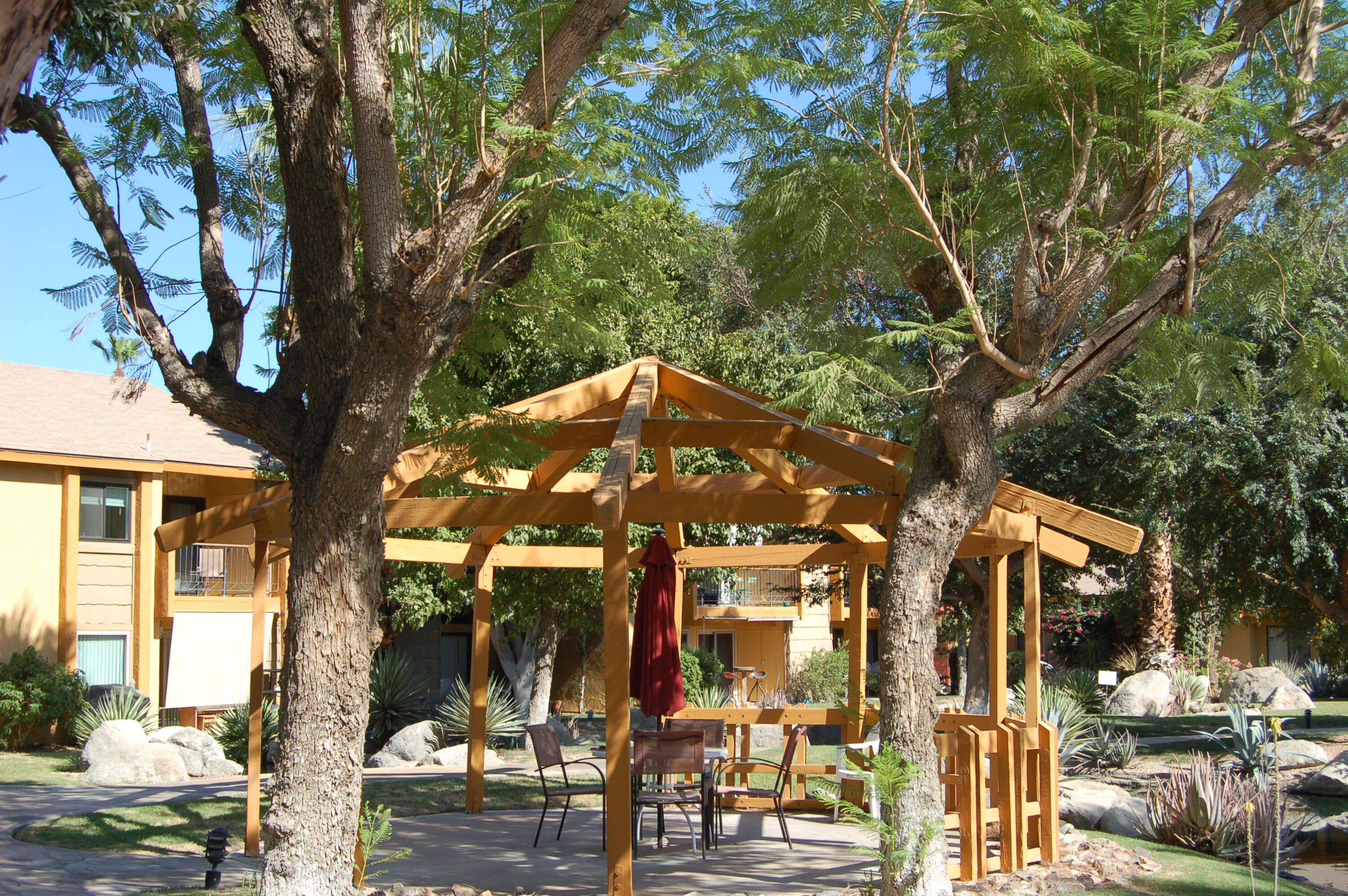 48255 Monroe Street, Unit 6 Indio, CA 92201 - Photo 34 of 43 a front view of a building with trees