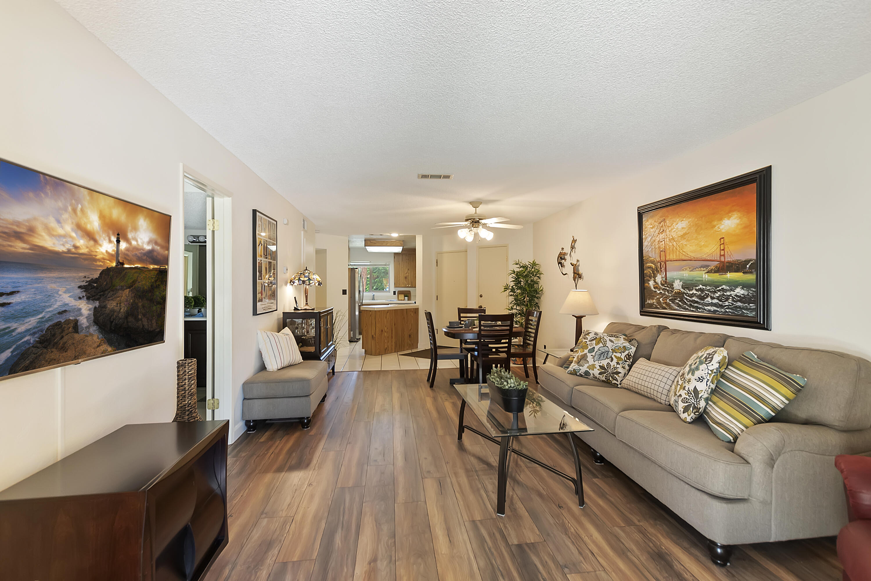 48255 Monroe Street, Unit 6 Indio, CA 92201 - Photo 4 of 43 a living room with furniture and a flat screen tv