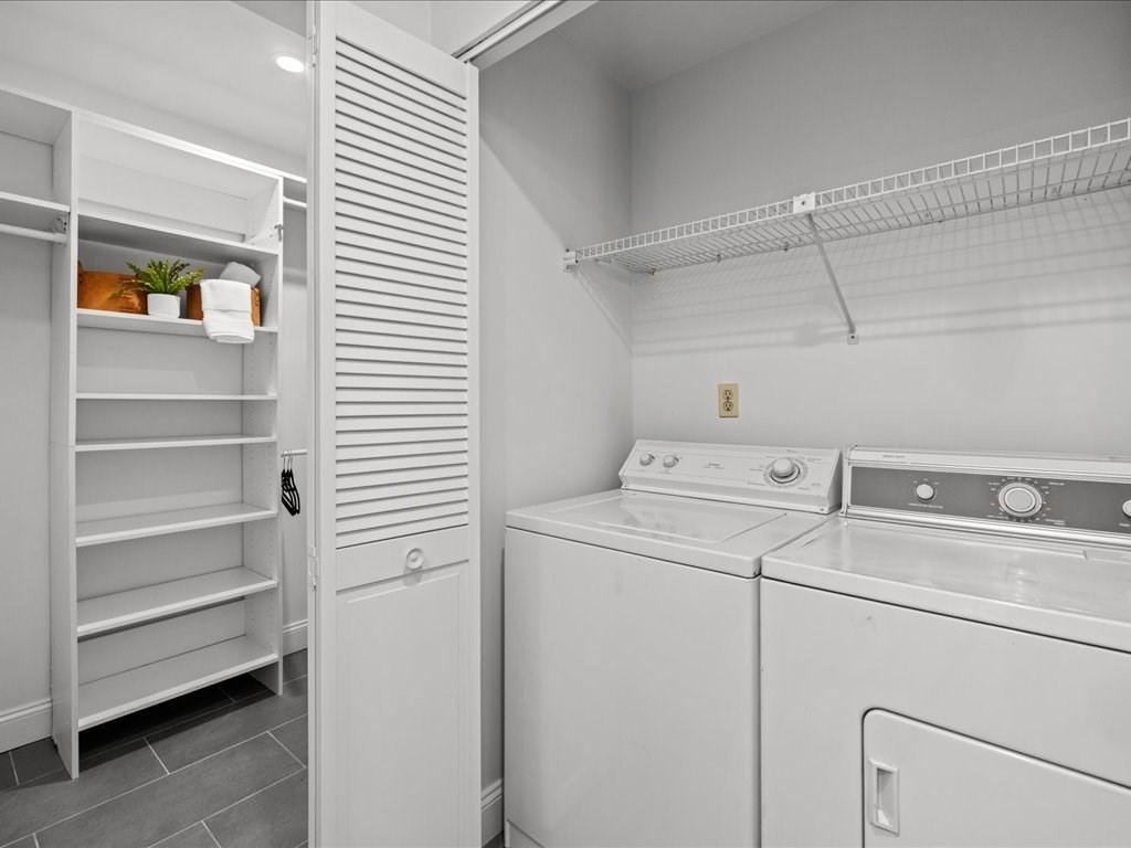 33 Sleeper Street, Unit 104 Boston, MA 02210 - Photo 15 of 23 a utility room with dryer and washer