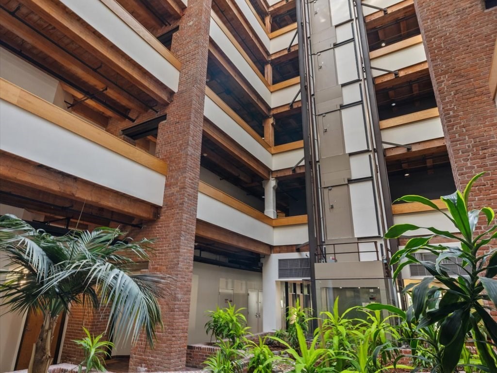 33 Sleeper Street, Unit 104 Boston, MA 02210 - Photo 21 of 23 a view of a building with a palm tree