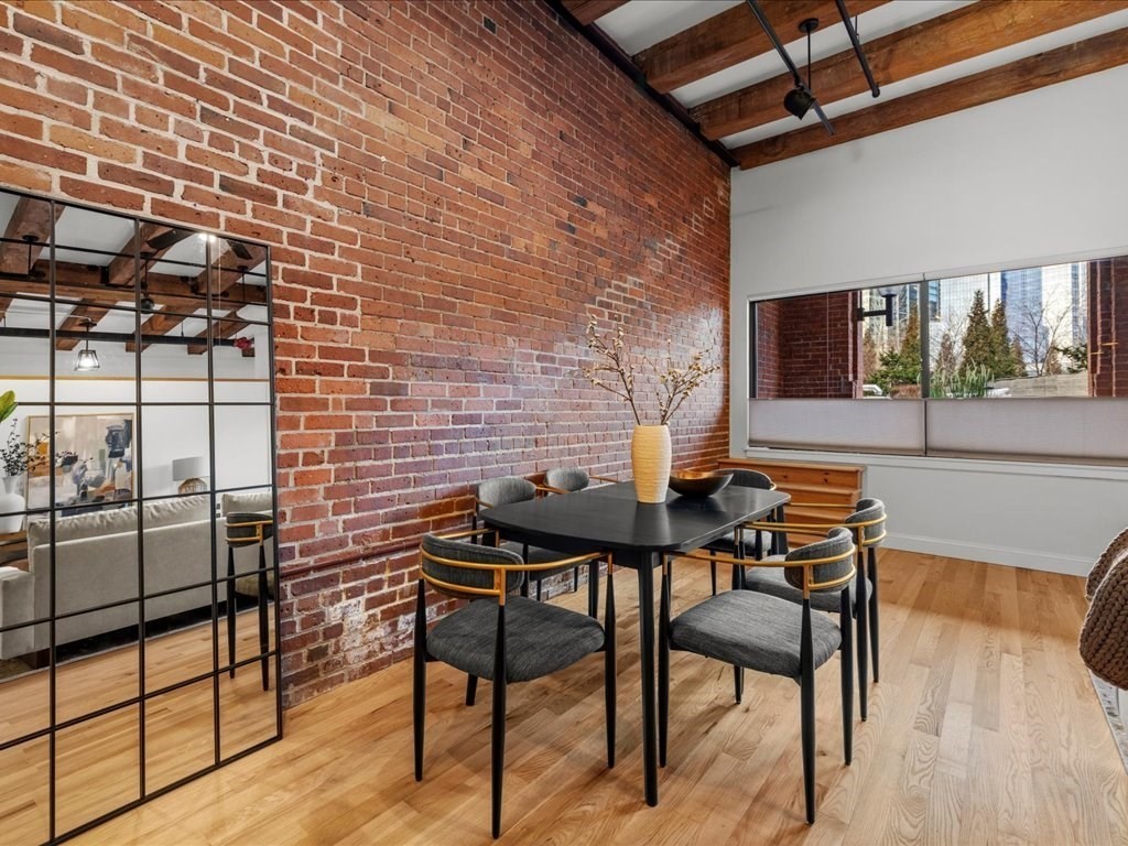 33 Sleeper Street, Unit 104 Boston, MA 02210 - Photo 3 of 23 a view of a backyard with a table and chairs and potted plants