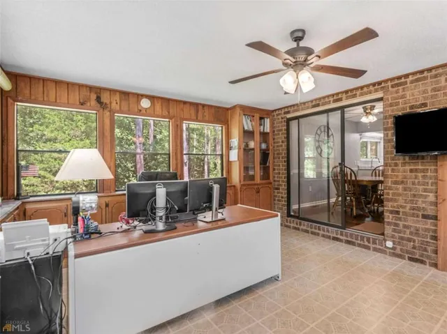 a kitchen with granite countertop a stove a sink a window and stainless steel appliances
