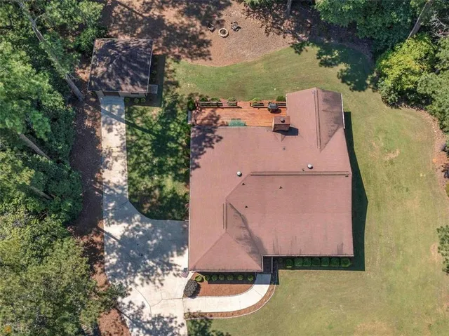 an aerial view of a house with outdoor space
