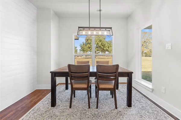 a dining room with furniture and window