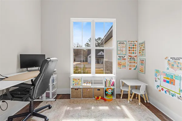 a bedroom with furniture and a window