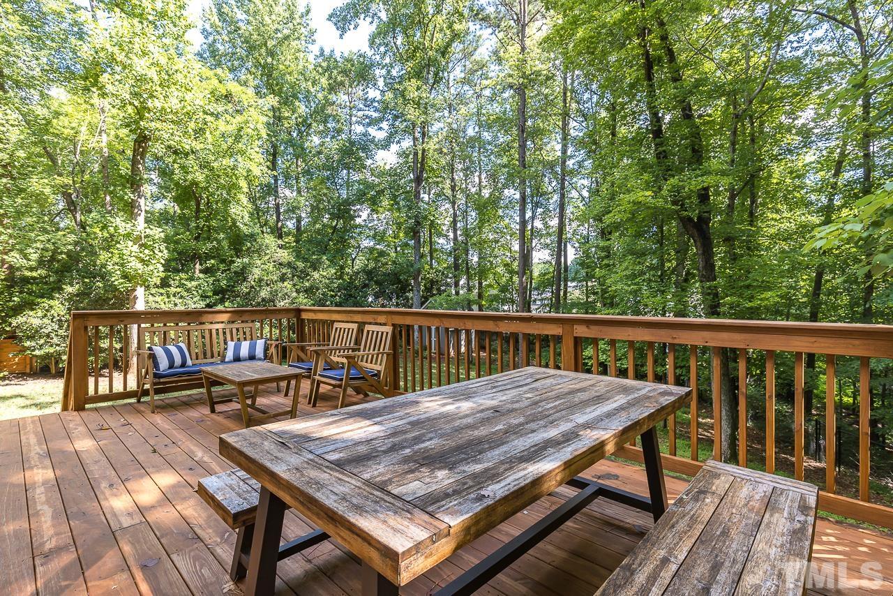 7929 Kingsland Drive Raleigh, NC 27613 - Photo 33 of 46 a view of a wooden deck with chairs