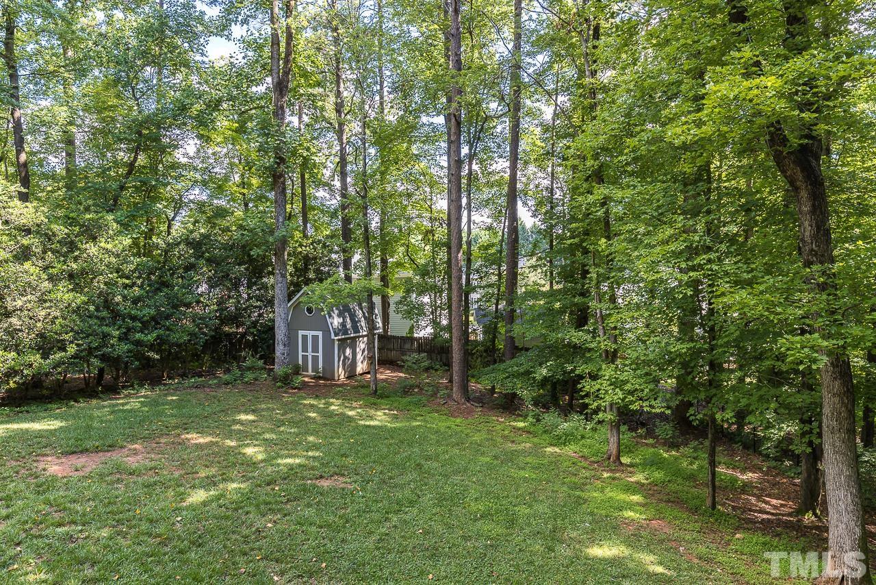 7929 Kingsland Drive Raleigh, NC 27613 - Photo 34 of 46 a view of a backyard with large trees