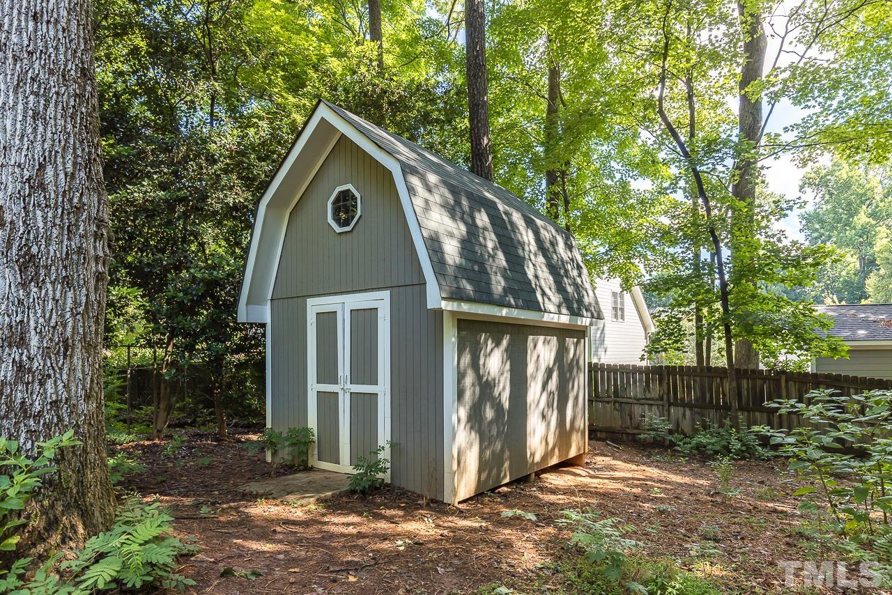 7929 Kingsland Drive Raleigh, NC 27613 - Photo 38 of 46 a front view of a house with garden