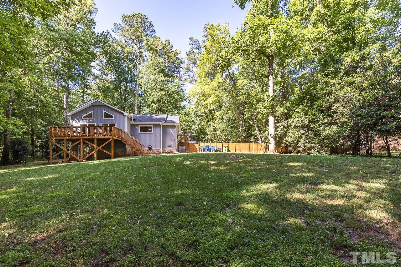 7929 Kingsland Drive Raleigh, NC 27613 - Photo 40 of 46 a view of a house with a big yard