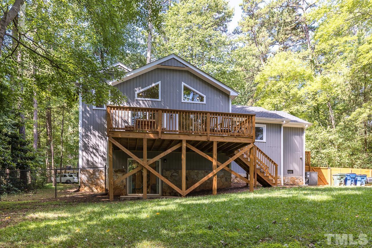 7929 Kingsland Drive Raleigh, NC 27613 - Photo 41 of 46 a view of a wooden house with a yard