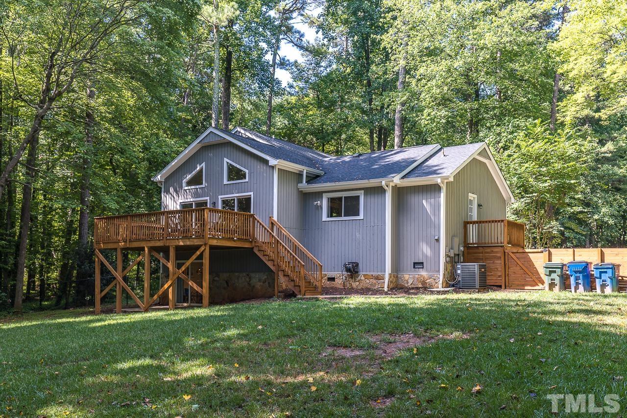 7929 Kingsland Drive Raleigh, NC 27613 - Photo 42 of 46 a front view of a house with garden