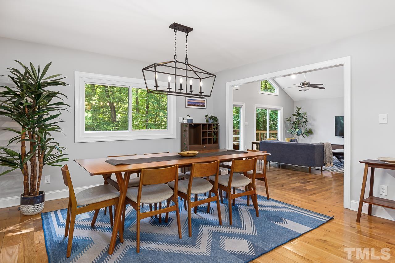 7929 Kingsland Drive Raleigh, NC 27613 - Photo 10 of 46 a view of a dining room with furniture window and wooden floor