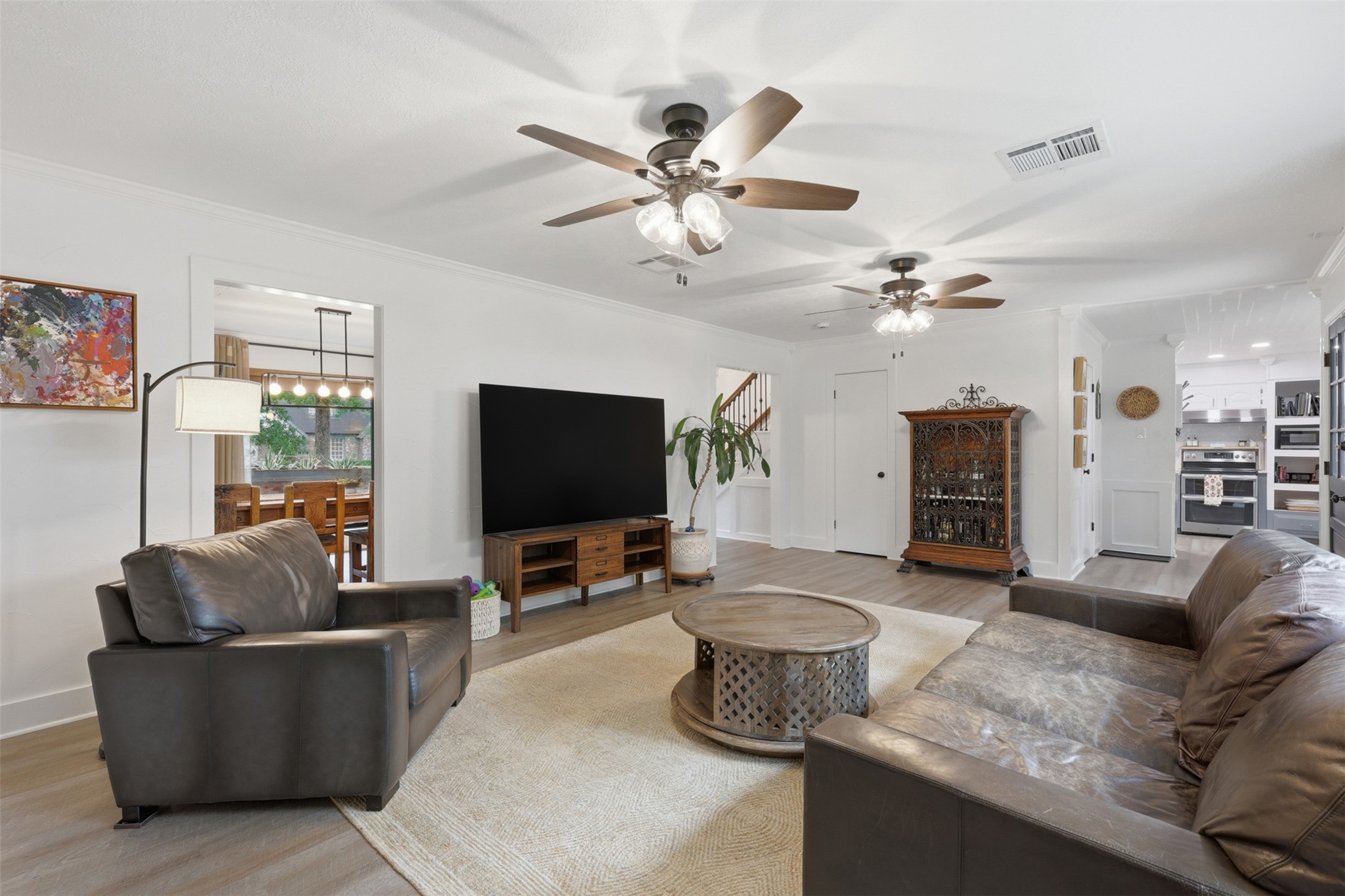 6126 Hickorycrest Drive Spring, TX 77389 - Photo 11 of 50 Bright and airy living area with a seamless flow to the kitchen and dining room.