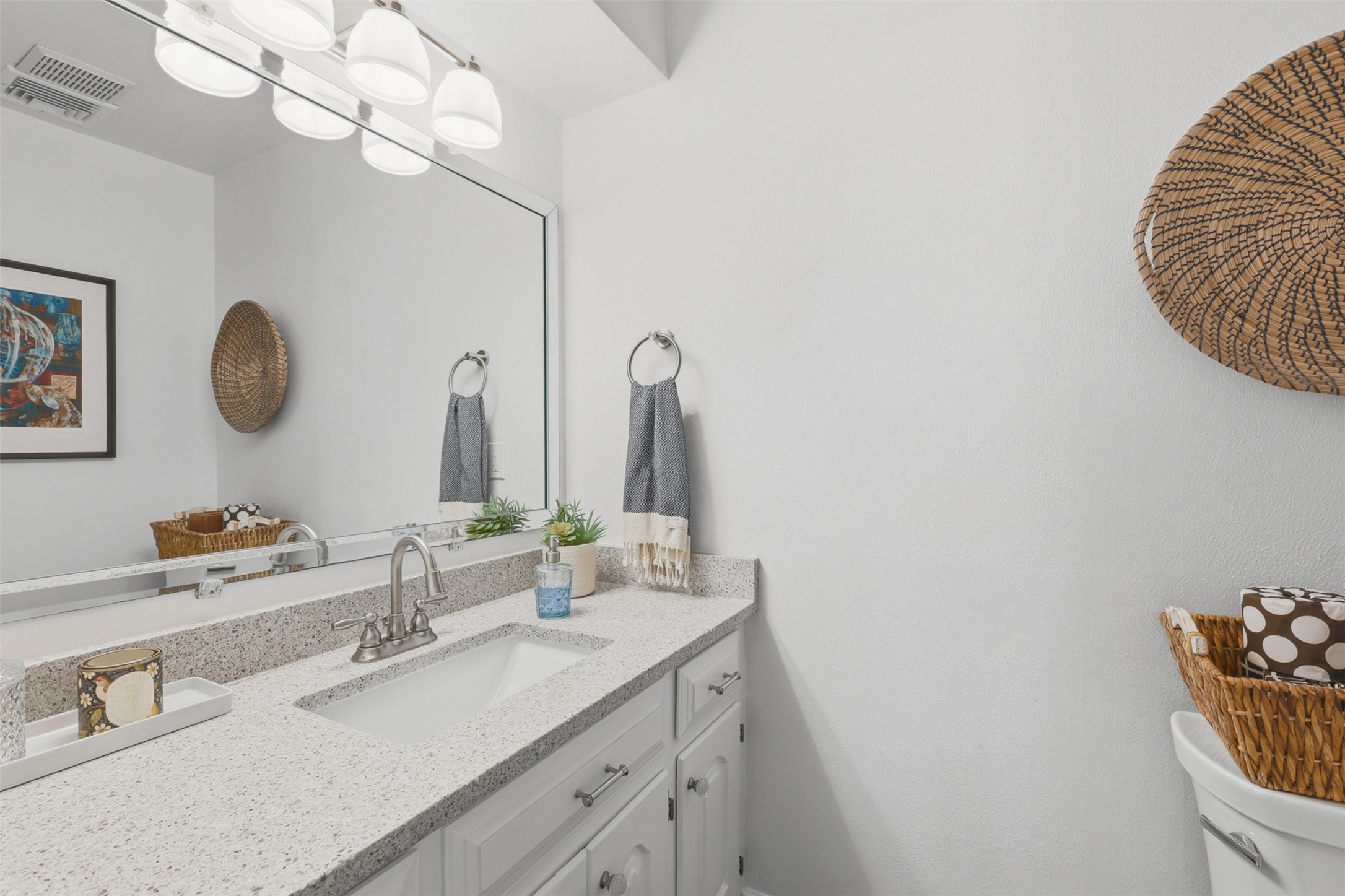 6126 Hickorycrest Drive Spring, TX 77389 - Photo 17 of 50 Half bathroom with a modern vanity and bright lighting.