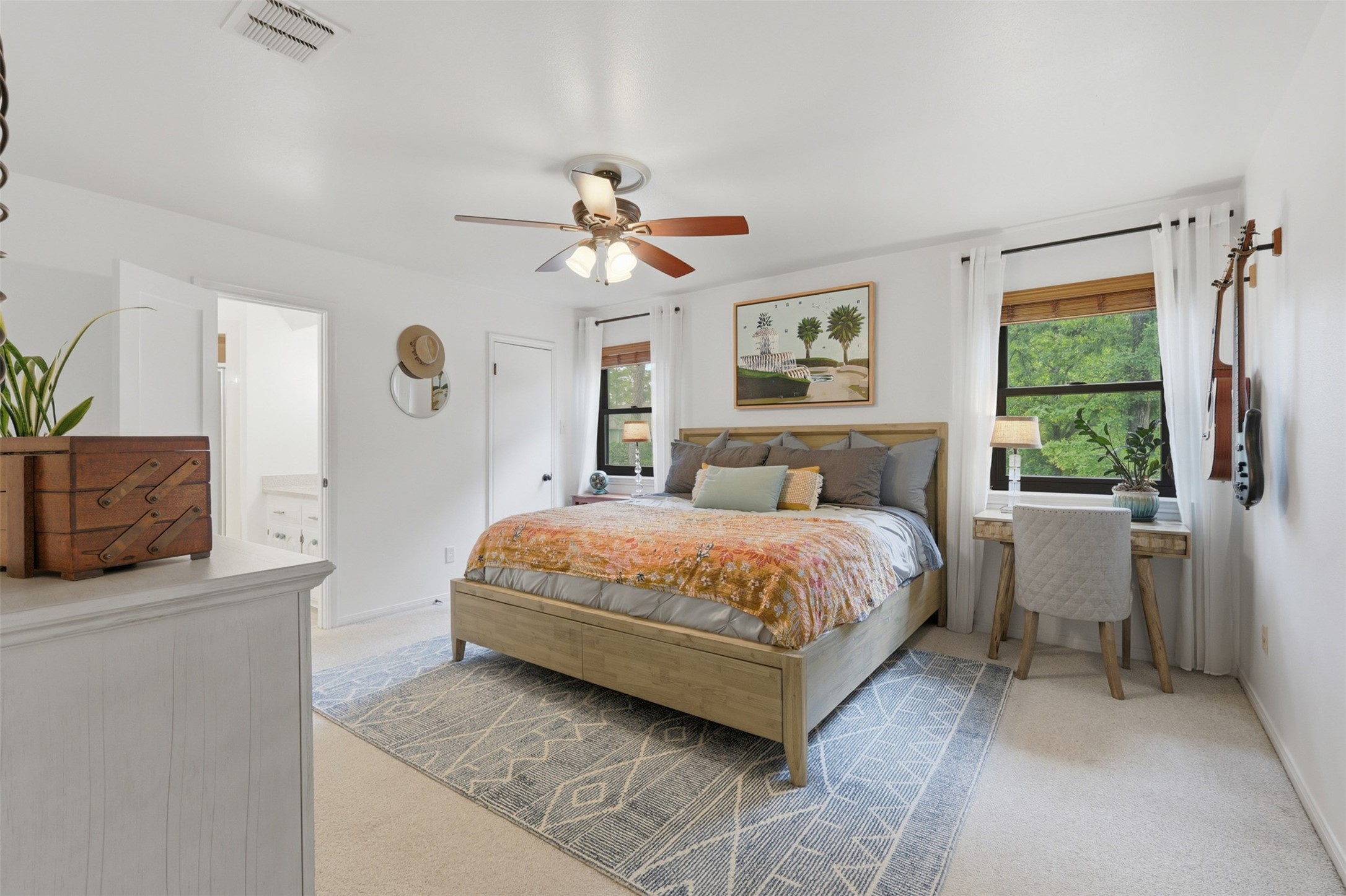 6126 Hickorycrest Drive Spring, TX 77389 - Photo 18 of 50 Primary bedroom with large windows, great natural light, and plush carpeting.