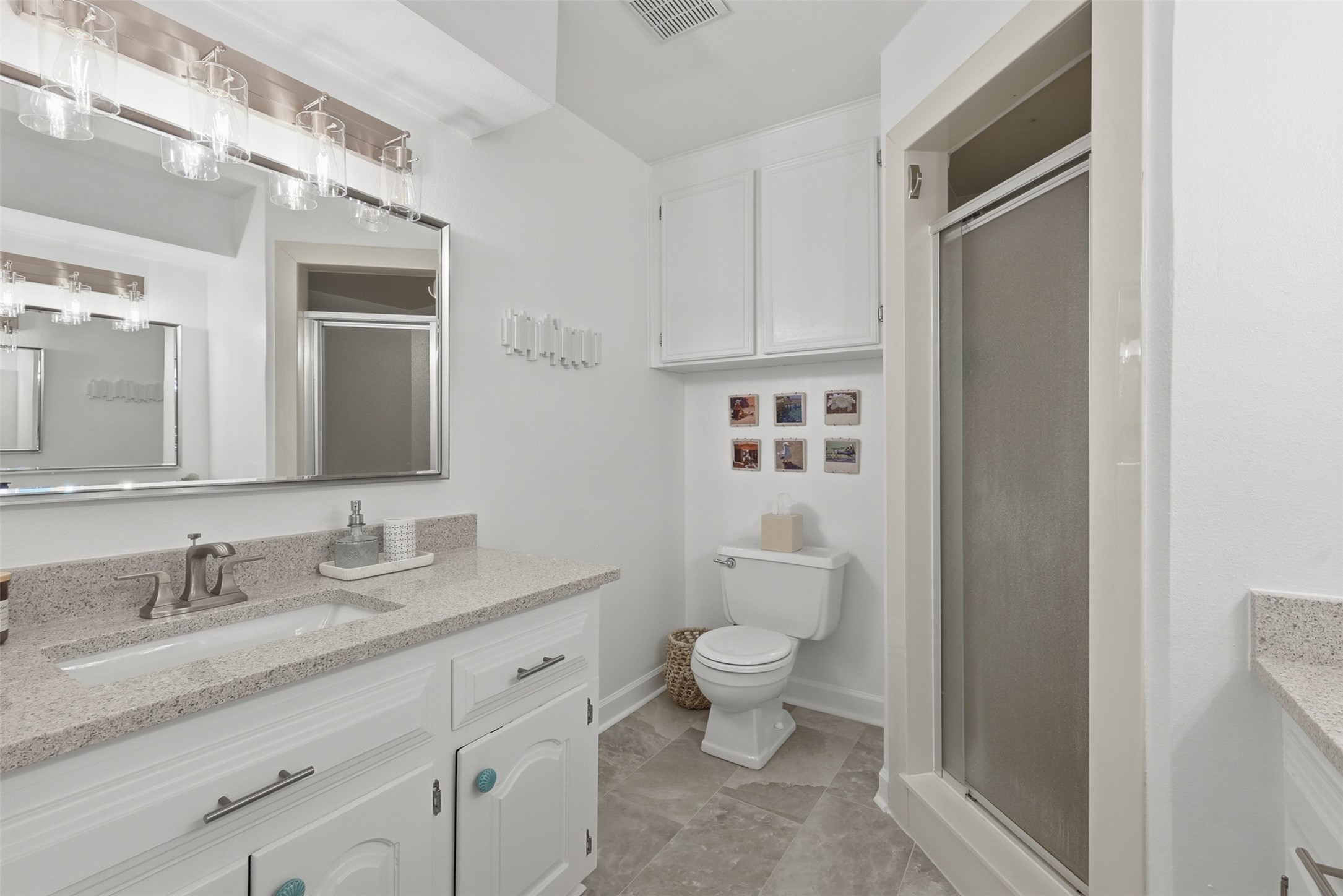 6126 Hickorycrest Drive Spring, TX 77389 - Photo 19 of 50 Primary bathroom with vanity space, mirror, and a walk-in shower.