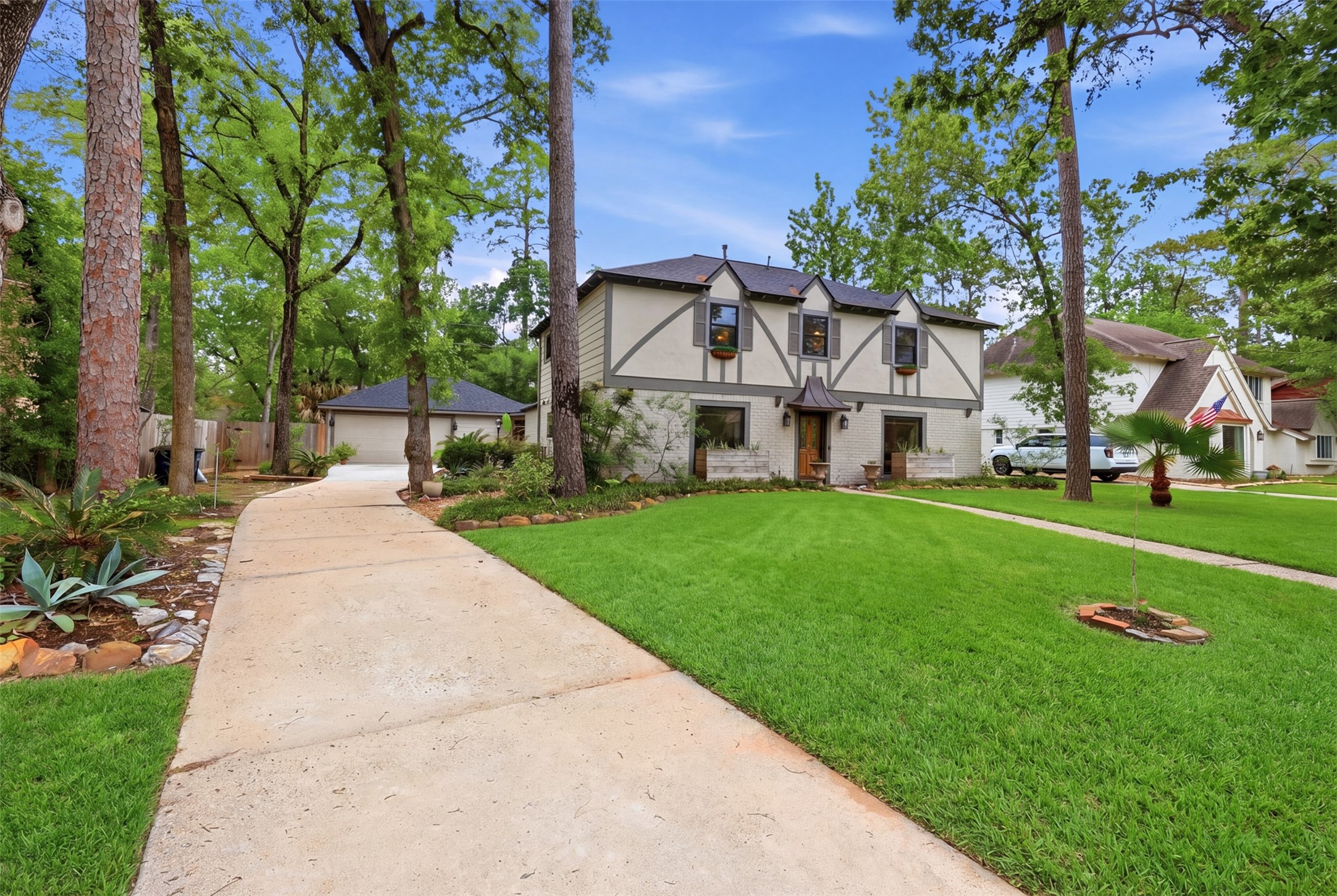 6126 Hickorycrest Drive Spring, TX 77389 - Photo 2 of 50 Long driveway leading to the home, surrounded by mature trees and lush landscaping.