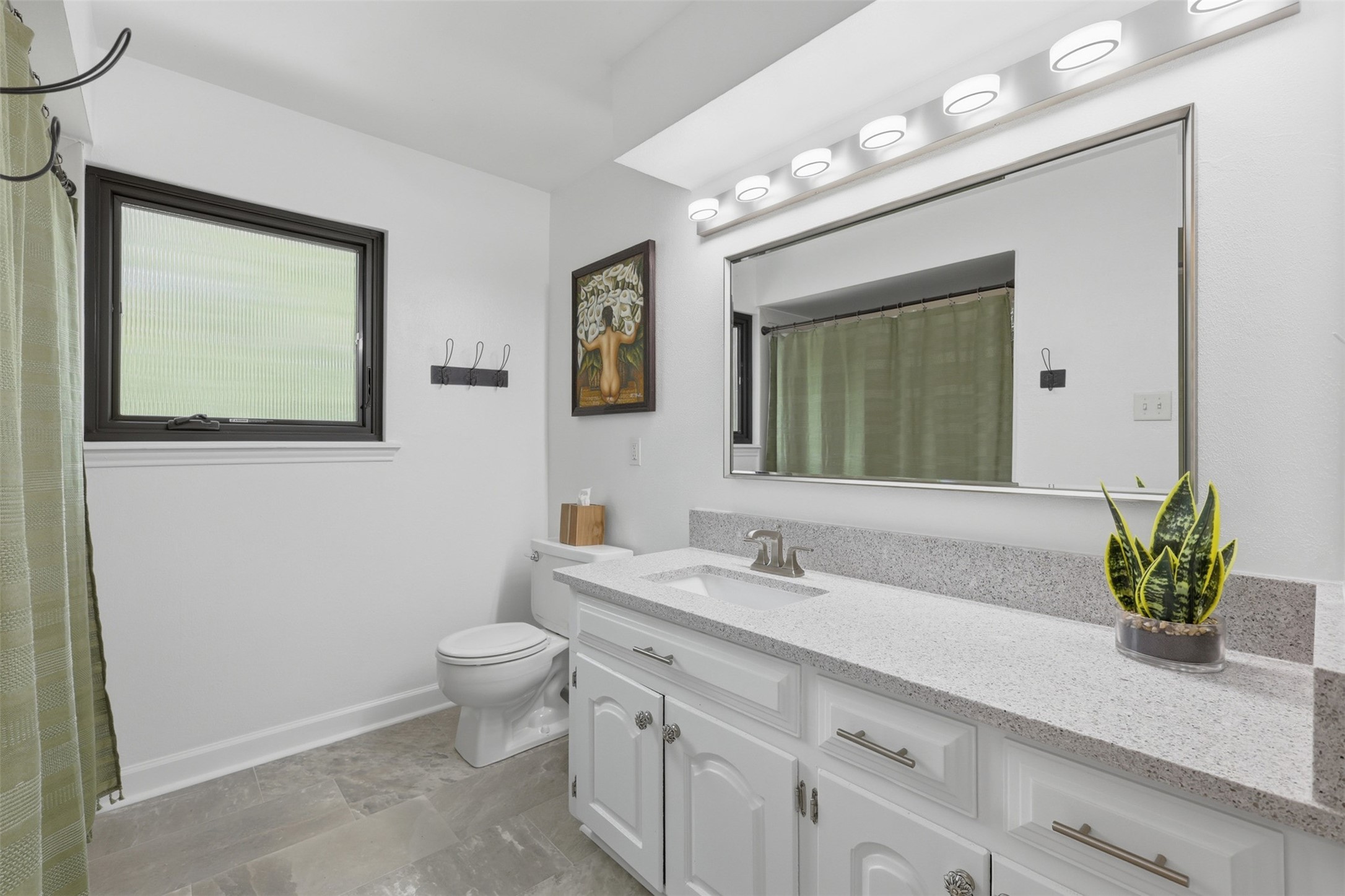6126 Hickorycrest Drive Spring, TX 77389 - Photo 24 of 50 Bathroom with a large mirror and large modern vanity.
