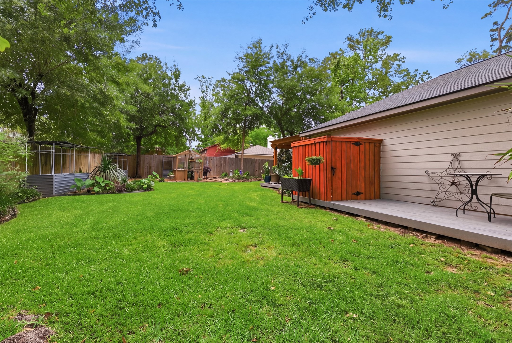 6126 Hickorycrest Drive Spring, TX 77389 - Photo 29 of 50 Large backyard with open green space, mature trees, and room to enjoy outdoor living.