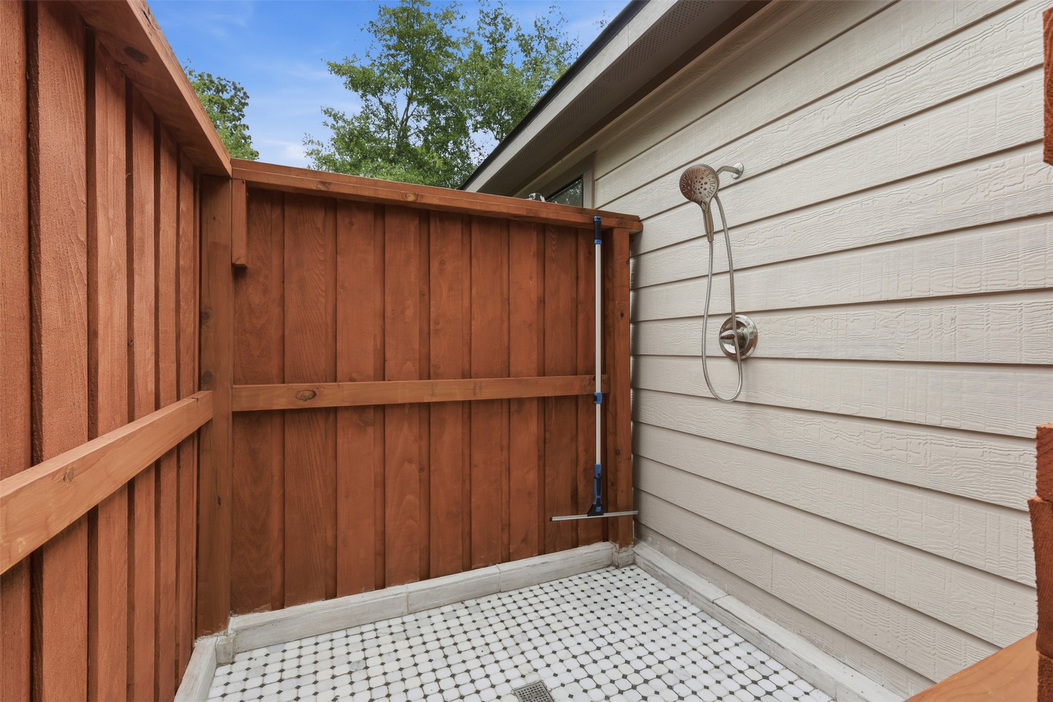 6126 Hickorycrest Drive Spring, TX 77389 - Photo 30 of 50 Private outdoor shower area, great for rinsing off after yard work or outdoor activities.