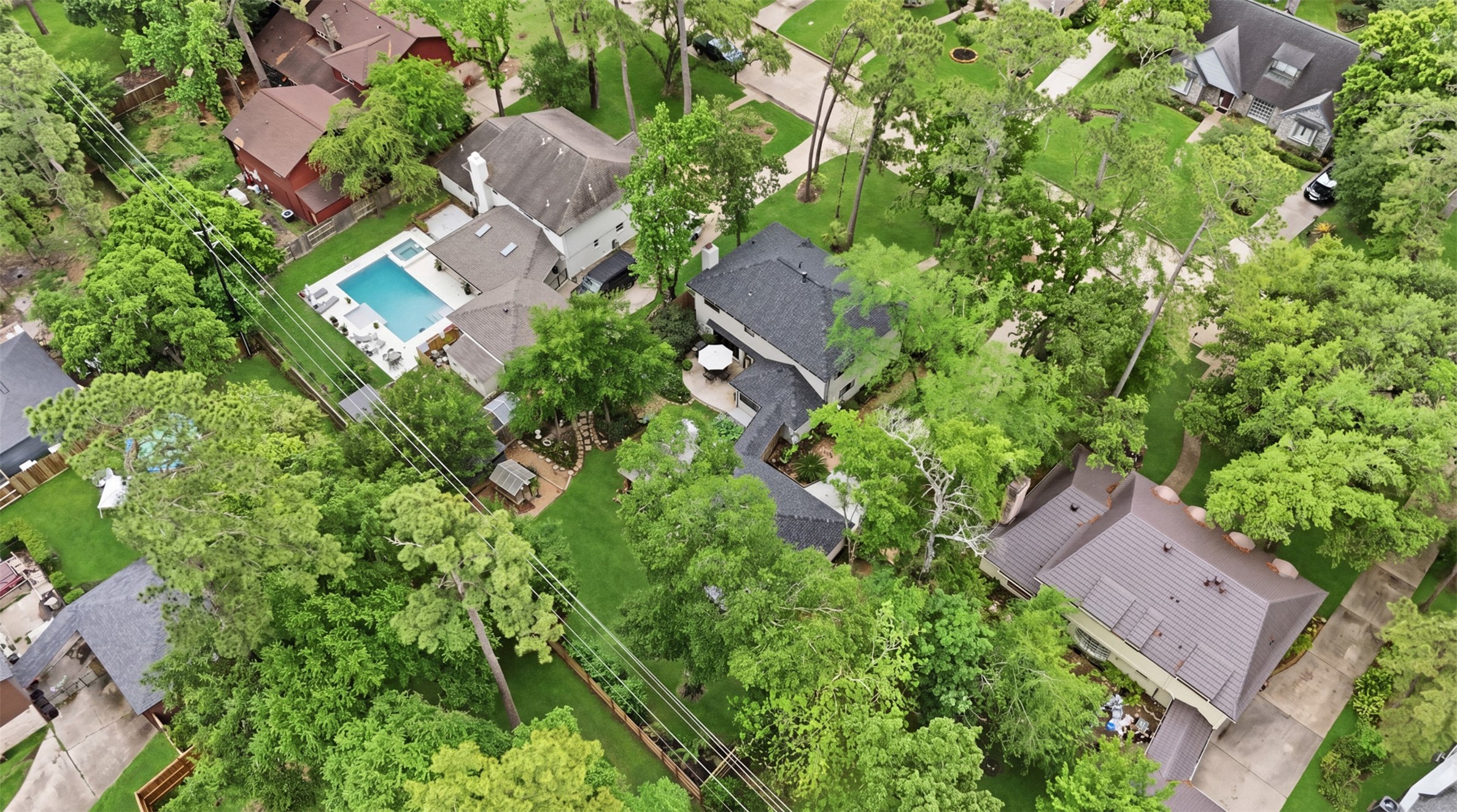 6126 Hickorycrest Drive Spring, TX 77389 - Photo 44 of 50 Aerial view of the neighborhood with tree-lined streets and surrounding homes.